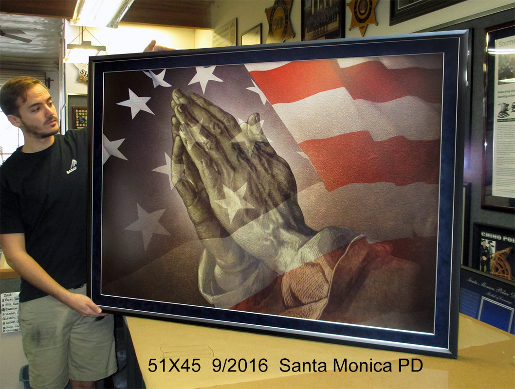 Santa Monica PD - Praying Hands
          and American Flag prestation from Badge Frame 9/216